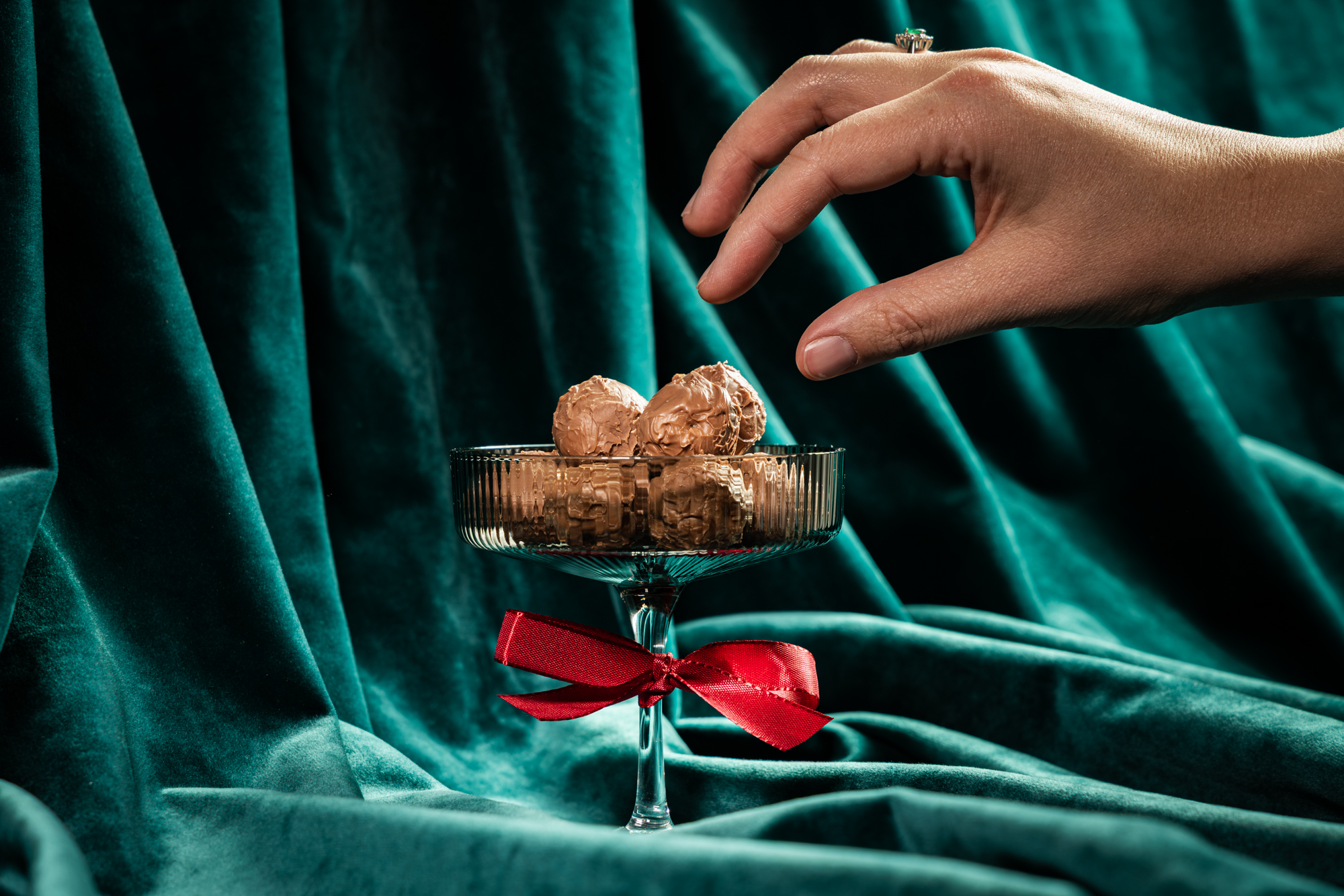 Sixteen pieces of handmade confectionery in a gift box